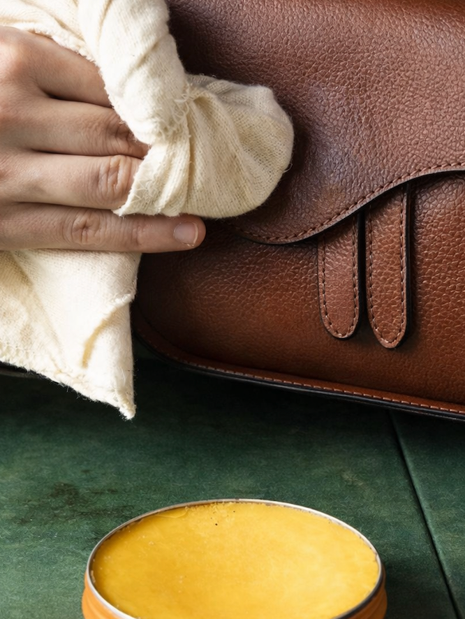 cleaning and taking care of a real leather bag with wax