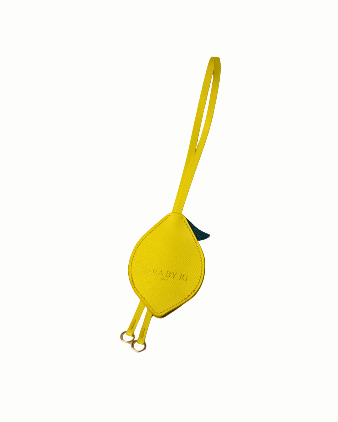 Yellow bird-shaped keychain with a green leaf on a white background